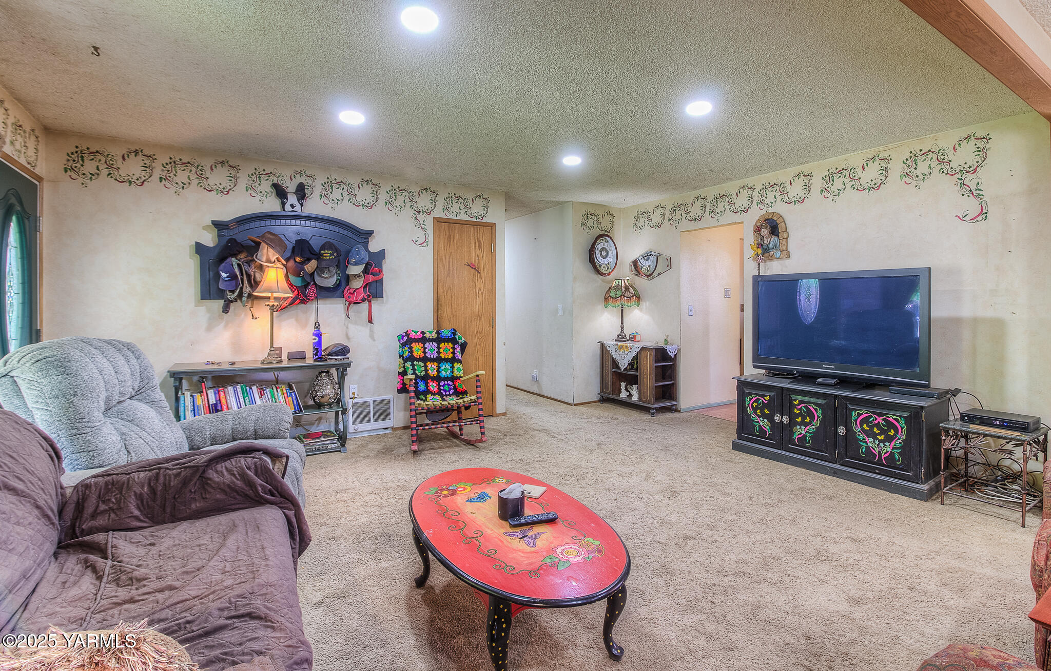 10608 Hackett Road Yakima, WA 98903 - Photo 9 of 40 a living room with furniture a flat screen tv and a couch