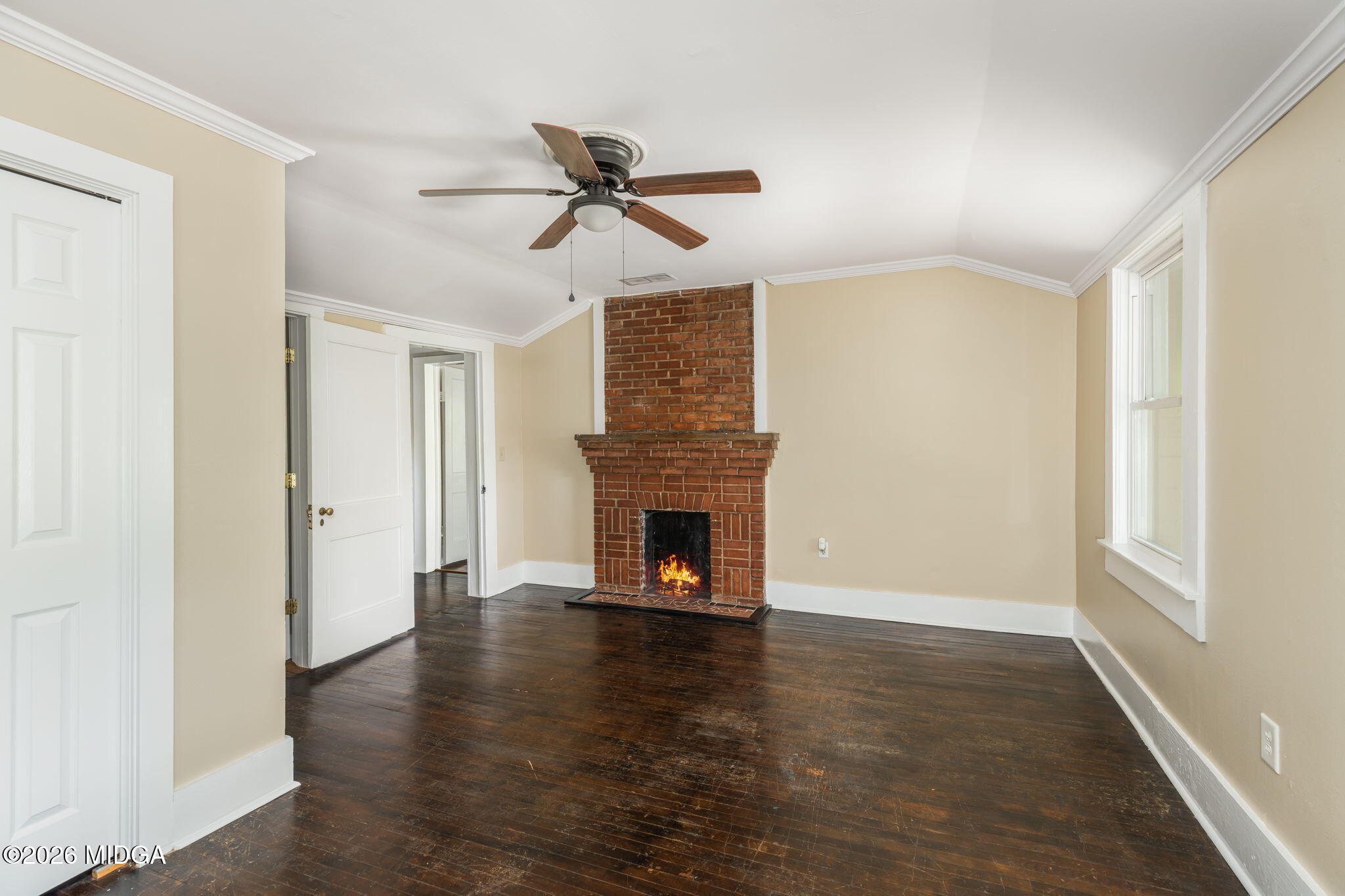 107 Childs Street Gray, GA 31032 - Photo 27 of 37 a view of a livingroom with a fireplace wooden floor and window