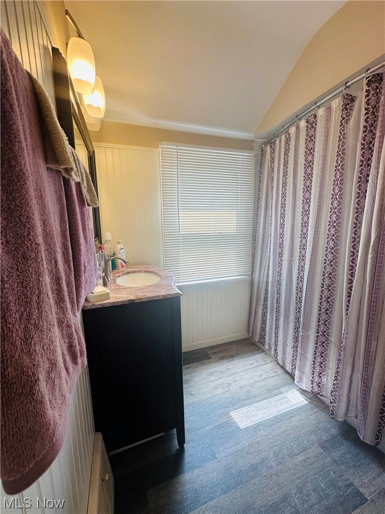 3894 Salisbury Road South Euclid, OH 44121 - Photo 10 of 16 Bathroom with vaulted ceiling, mirror, and vanity