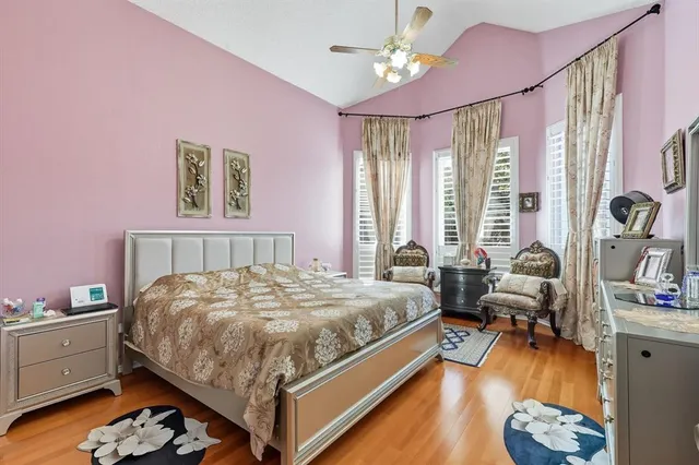 a bedroom with a bed couch and a window