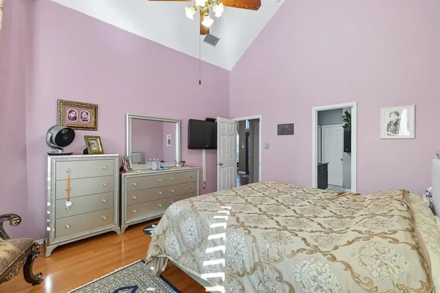 a bedroom with a bed and a dresser