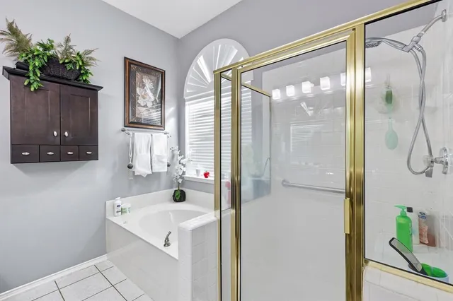 a bathroom with a sink a mirror and a shower