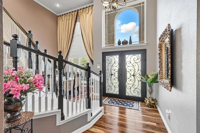 a view of front door with wooden floor