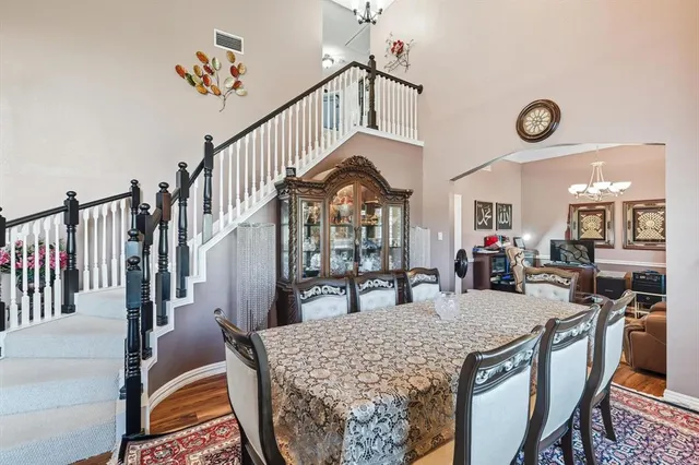 a view of a room with furniture and wooden floor