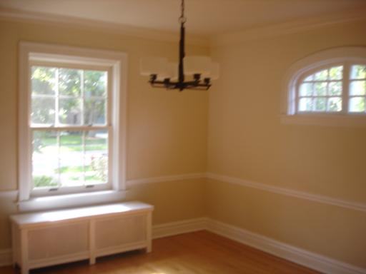 292 Blackhawk Road Riverside, IL 60546 - Photo 3 of 13 a bathroom with a window a bathtub and shower