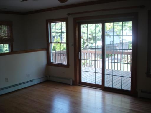 292 Blackhawk Road Riverside, IL 60546 - Photo 6 of 13 a view of an empty room with wooden floor and a window