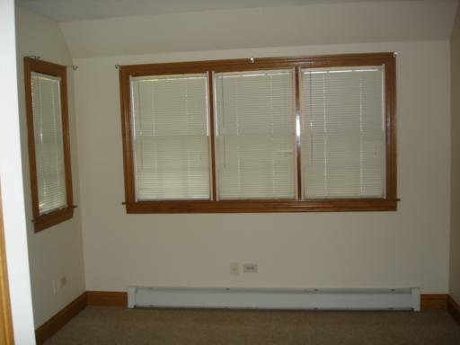 292 Blackhawk Road Riverside, IL 60546 - Photo 10 of 13 a view of a small space with wooden floor and a window