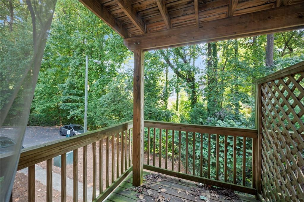 3665 Chestnut Drive, Unit D3 Atlanta, GA 30340 - Photo 4 of 16 a view of a wooden deck next to a yard