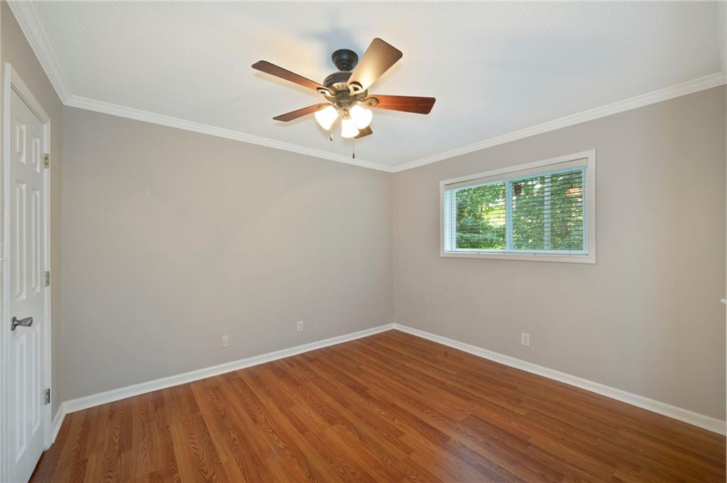3665 Chestnut Drive, Unit D3 Atlanta, GA 30340 - Photo 6 of 16 a view of a room with wooden floor and fan