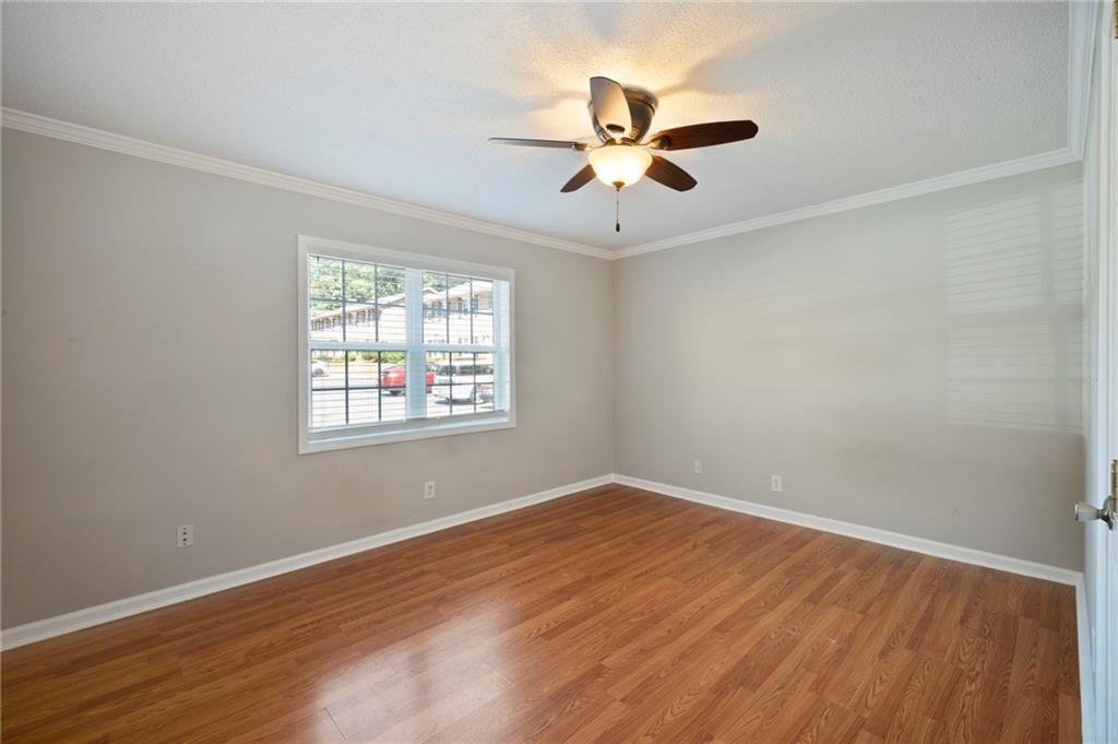3665 Chestnut Drive, Unit D3 Atlanta, GA 30340 - Photo 9 of 16 wooden floor in an empty room with a window