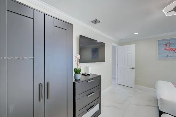 a kitchen with stainless steel appliances a sink a stove a microwave and cabinets