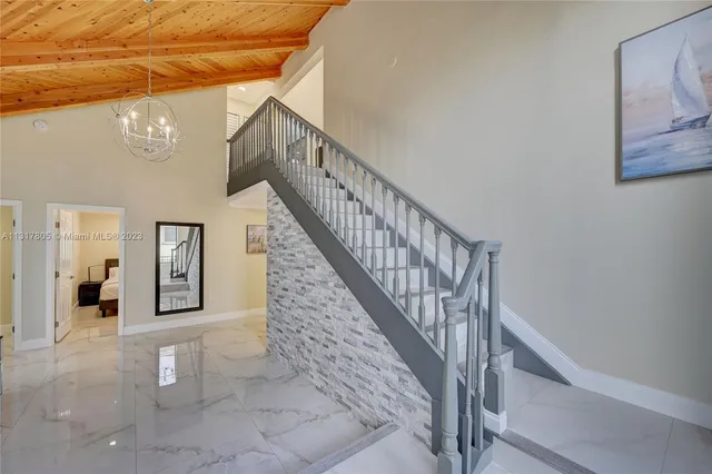 a kitchen with stainless steel appliances a sink a stove a microwave and cabinets