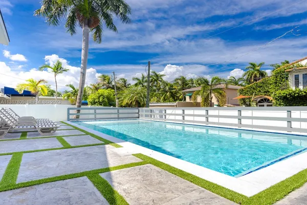 a view of yard with swimming pool
