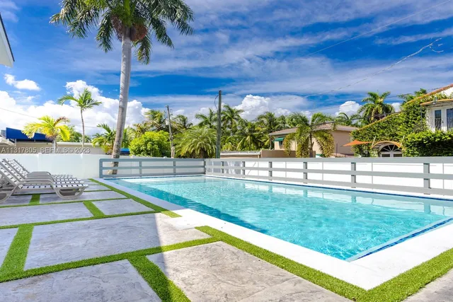 a view of yard with swimming pool