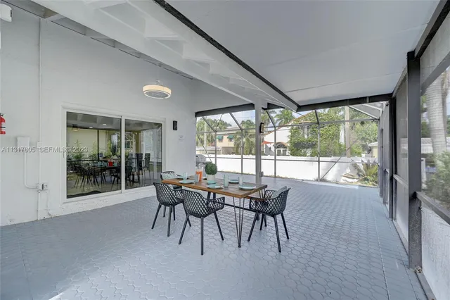 a view of a chairs and table in patio