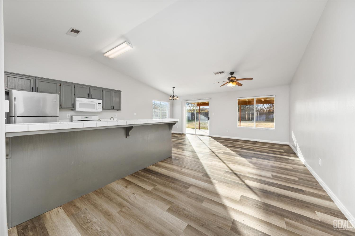 Undisclosed Address Bakersfield, CA 93308 - Photo 11 of 37 a view of kitchen and kitchen with sink
