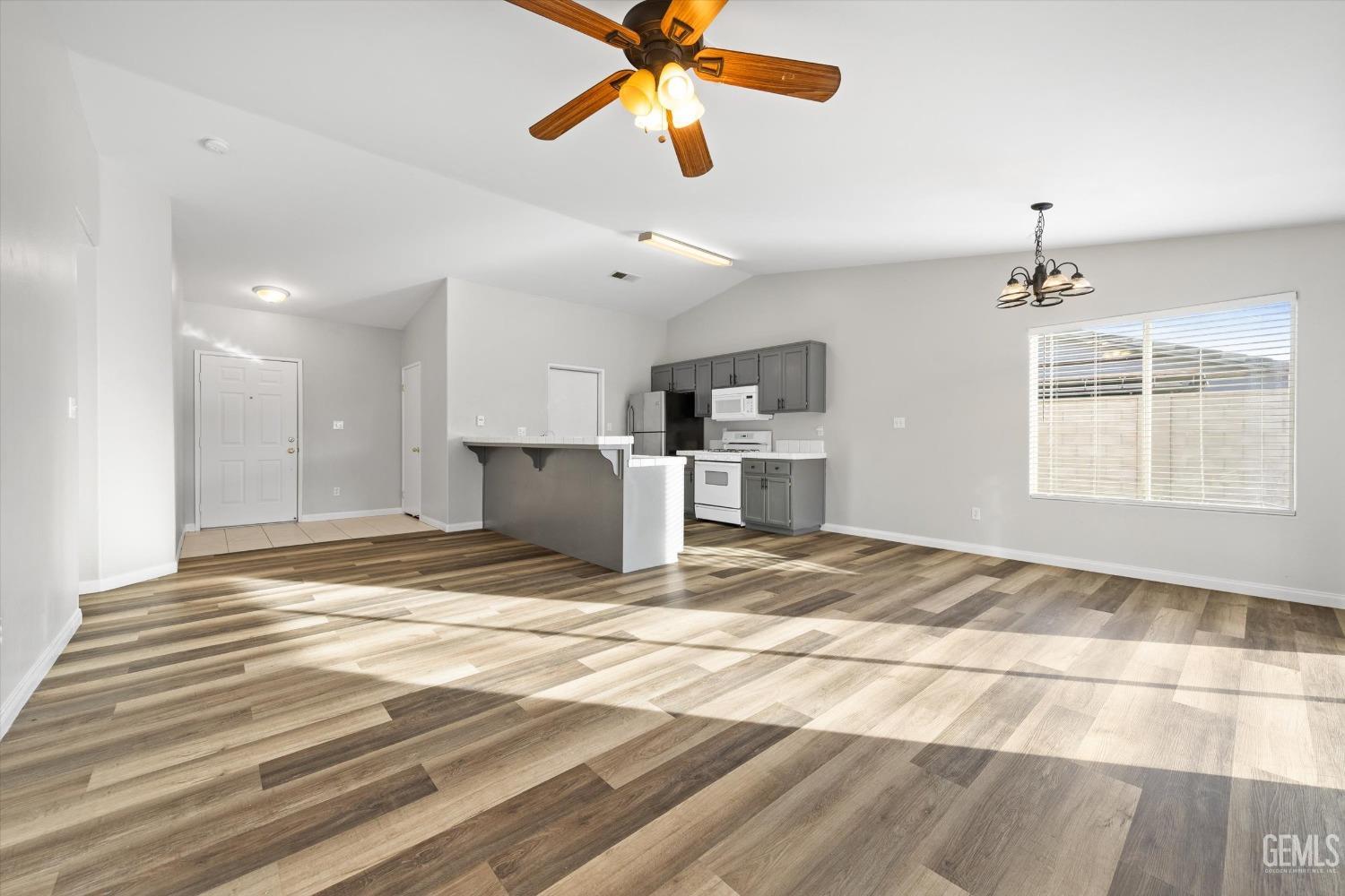 Undisclosed Address Bakersfield, CA 93308 - Photo 12 of 37 a view of a livingroom with a kitchen