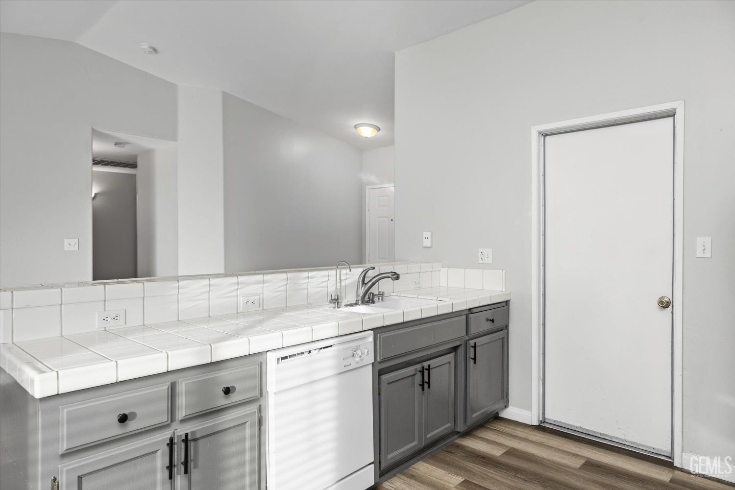 Undisclosed Address Bakersfield, CA 93308 - Photo 20 of 37 a bathroom with double sink and a mirror