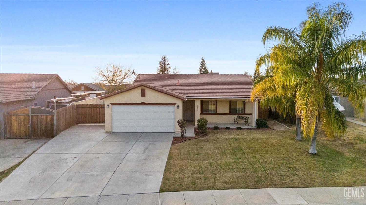 Undisclosed Address Bakersfield, CA 93308 - Photo 2 of 37 a house view with a backyard space