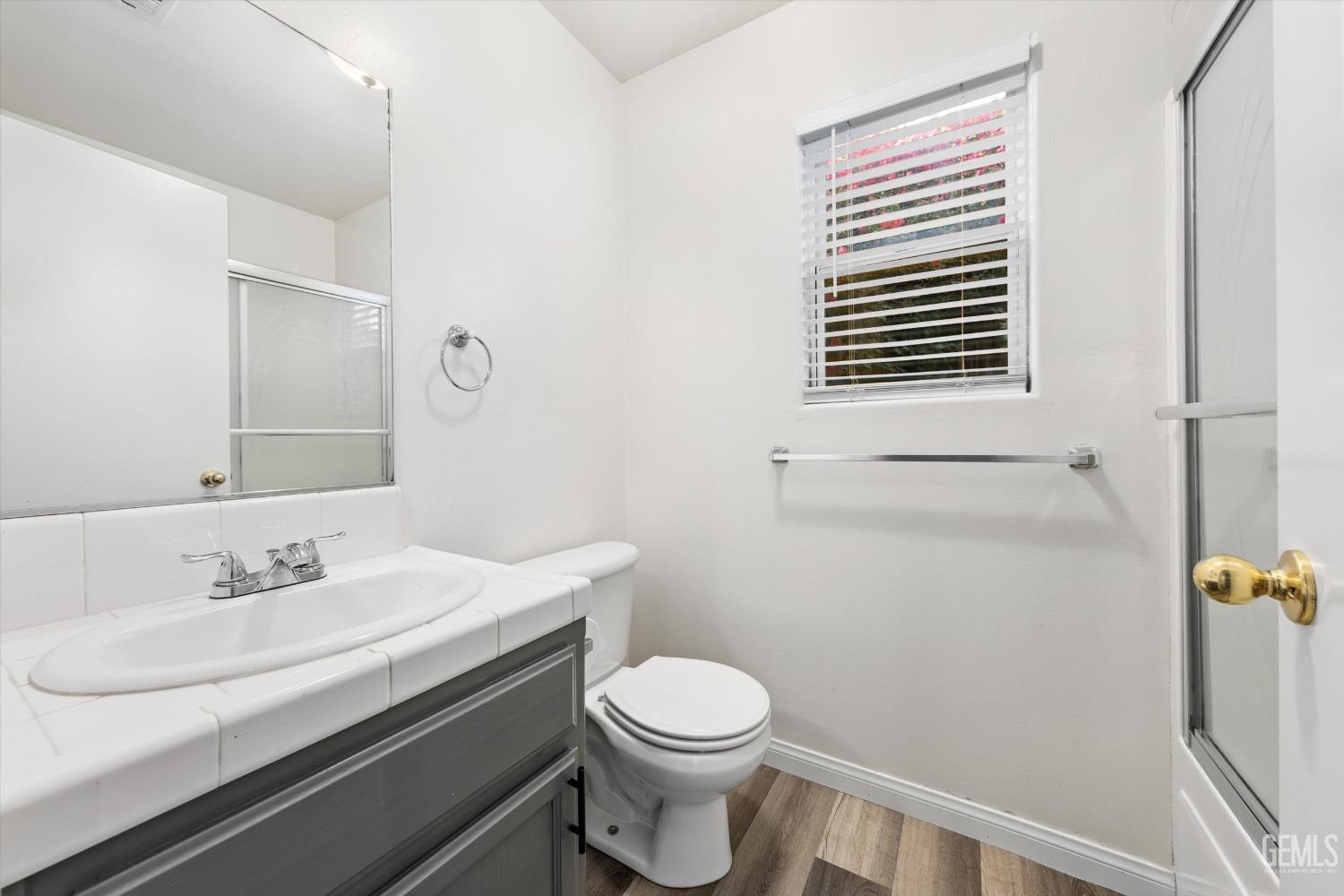 Undisclosed Address Bakersfield, CA 93308 - Photo 27 of 37 a bathroom with a sink toilet and shower
