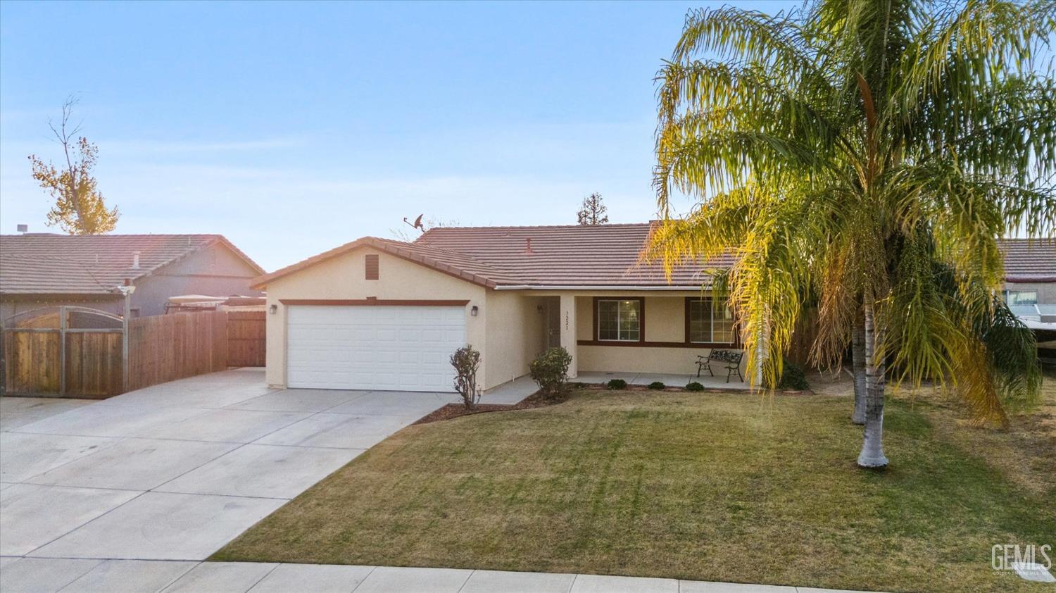 Undisclosed Address Bakersfield, CA 93308 - Photo 3 of 37 a view of a house with a yard