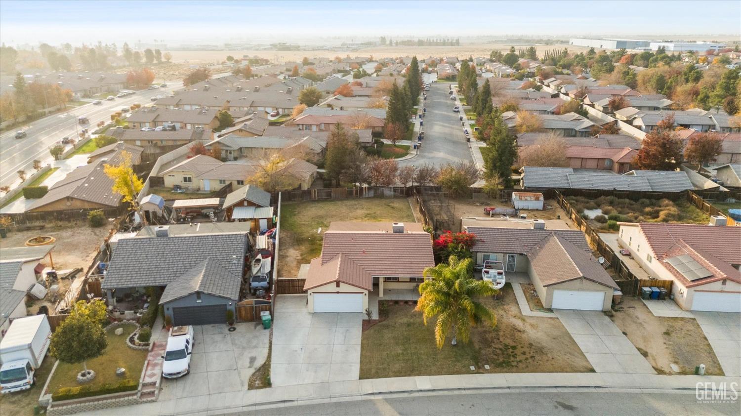 Undisclosed Address Bakersfield, CA 93308 - Photo 4 of 37 an aerial view of residential houses with outdoor space and parking