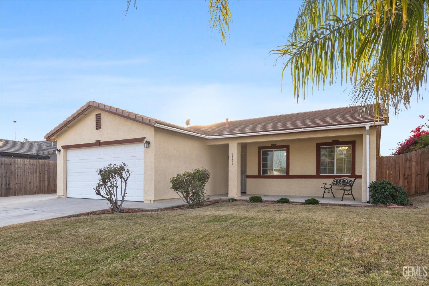 Undisclosed Address Bakersfield, CA 93308 - Photo 8 of 37 a front view of a house with garden