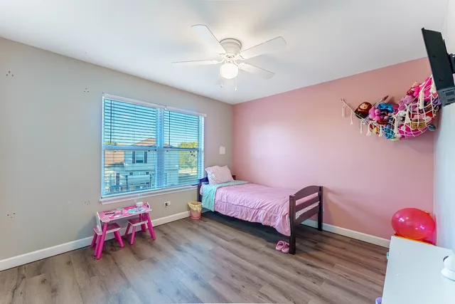 a bedroom with furniture and a window