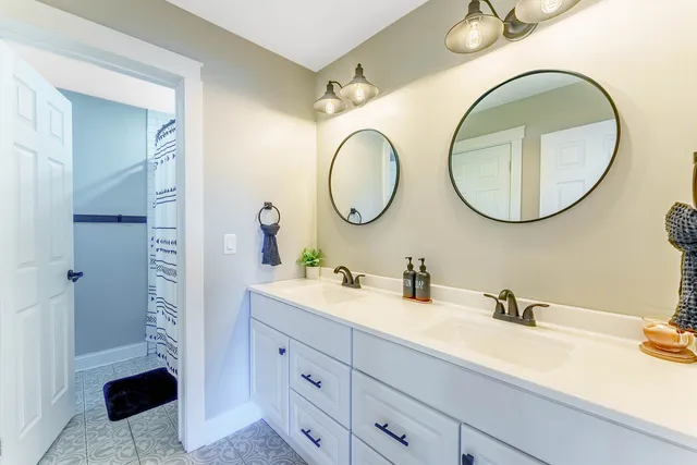 a bathroom with a sink and a mirror