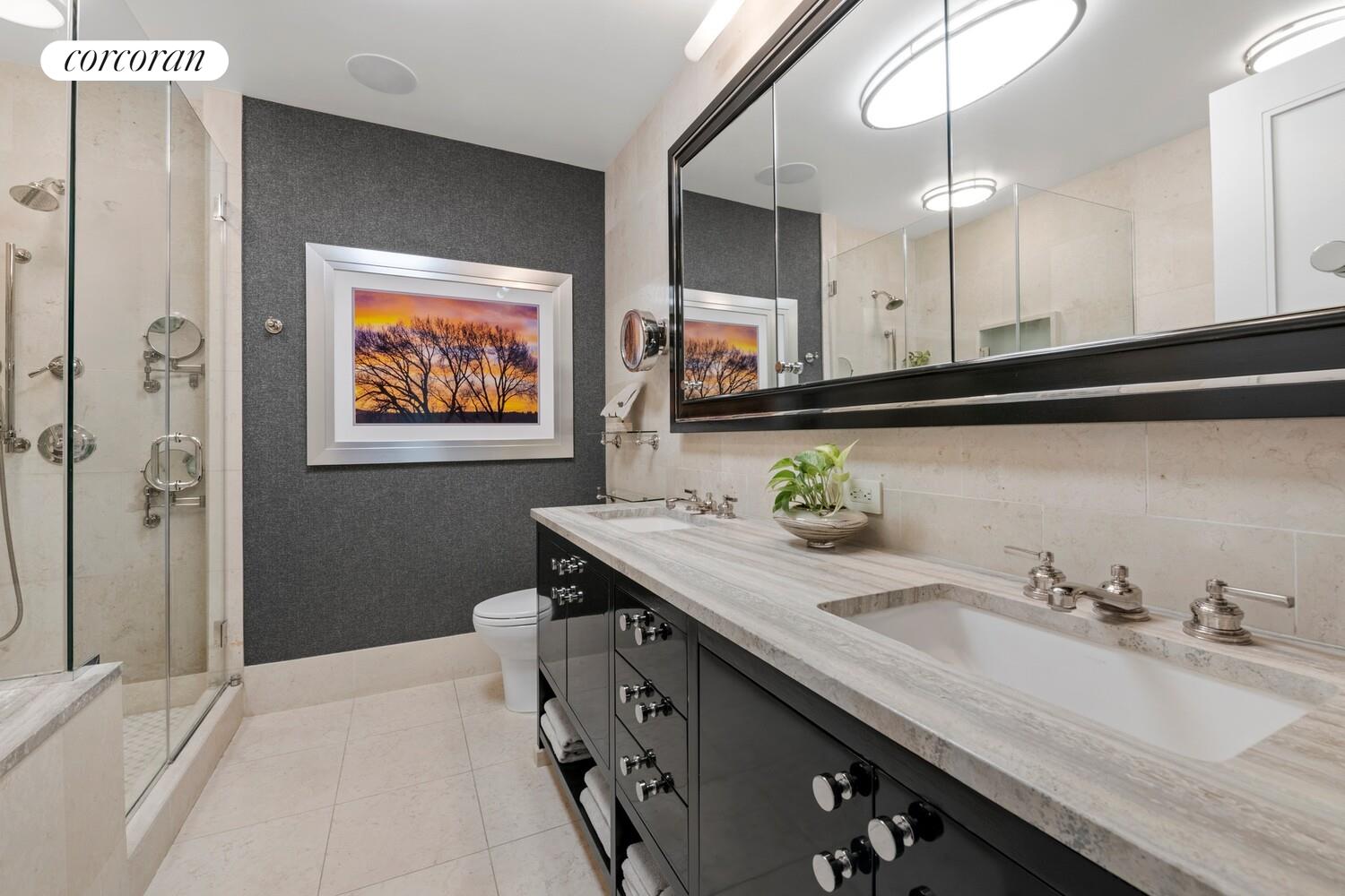 100 Riverside Boulevard, Unit PHB Manhattan, NY 10069 - Photo 20 of 34 a bathroom with a sink a mirror and a shower