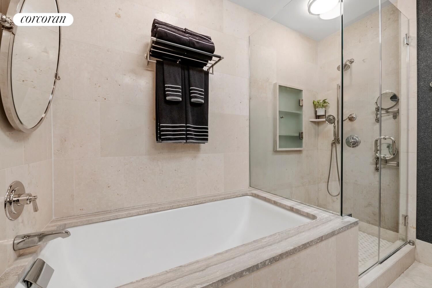 100 Riverside Boulevard, Unit PHB Manhattan, NY 10069 - Photo 21 of 34 a bathroom with a tub and a shower