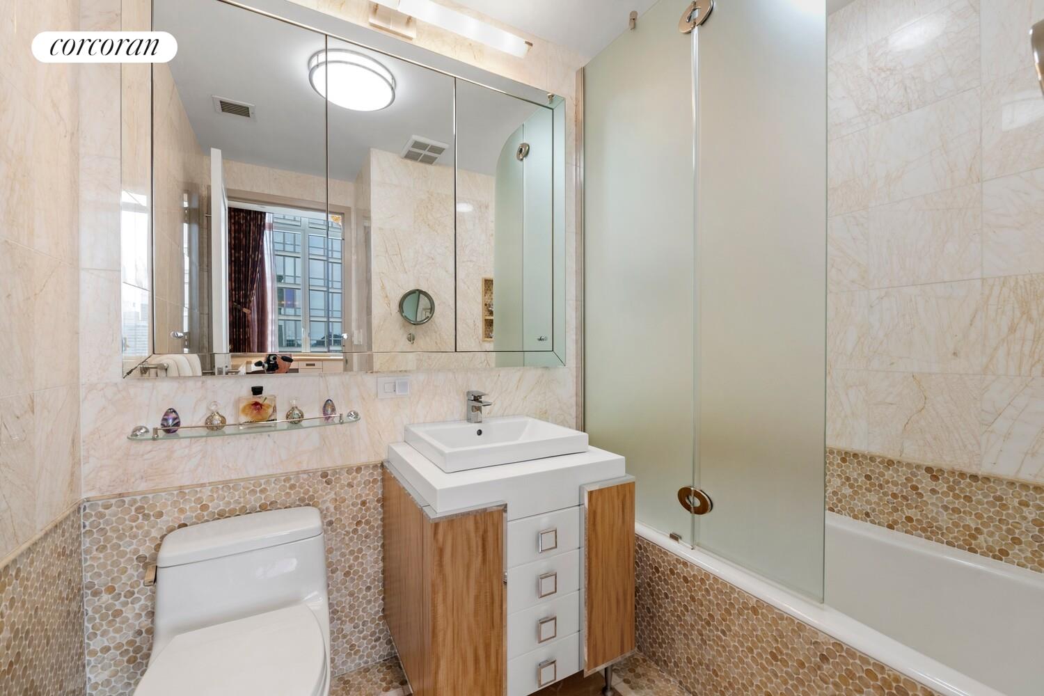 100 Riverside Boulevard, Unit PHB Manhattan, NY 10069 - Photo 25 of 34 a bathroom with a sink a toilet and shower