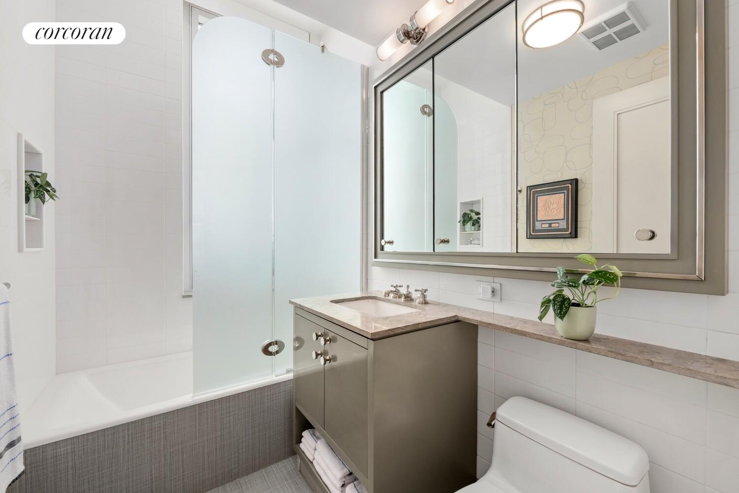 100 Riverside Boulevard, Unit PHB Manhattan, NY 10069 - Photo 27 of 34 a bathroom with a sink toilet and shower