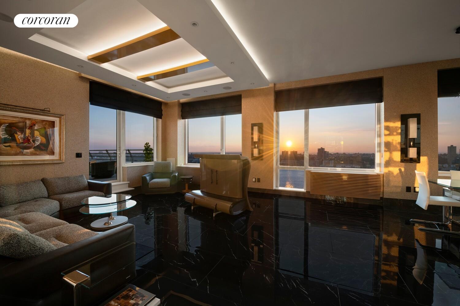 100 Riverside Boulevard, Unit PHB Manhattan, NY 10069 - Photo 29 of 34 a living room with furniture kitchen view and a large window