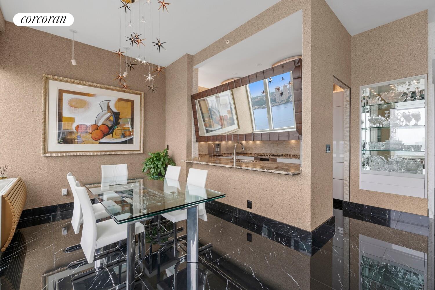 100 Riverside Boulevard, Unit PHB Manhattan, NY 10069 - Photo 9 of 34 a view of a dining room with furniture window and wooden floor