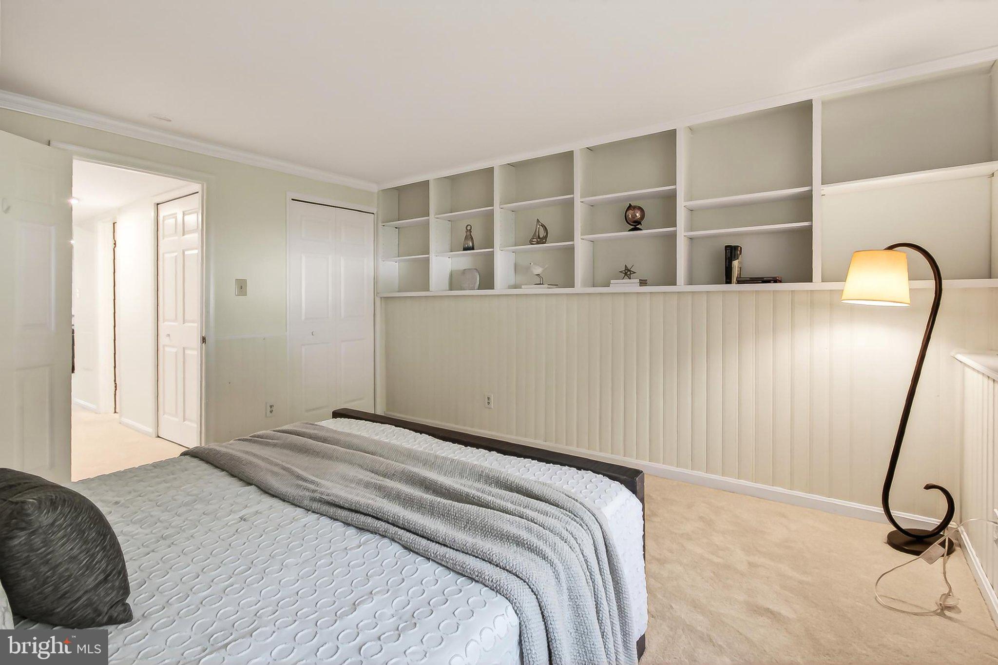 6908 Rochambeau Place Springfield, VA 22153 - Photo 39 of 70 Bedroom 4 with wall of shelves & new neut carpet
