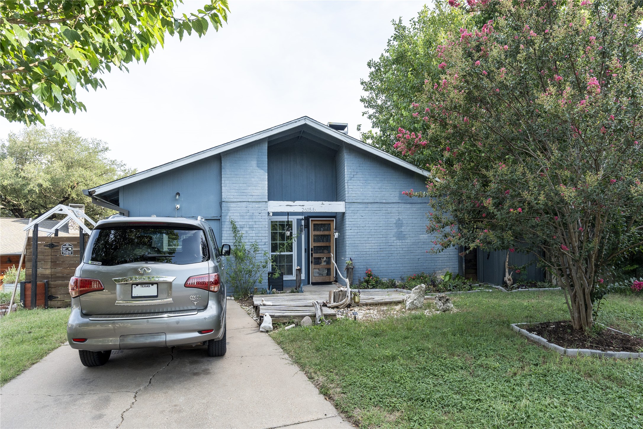 2605 Reeves Circle Austin, TX 78741 - Photo 2 of 2 A well-maintained home with mature landscaping and a welcoming entry.