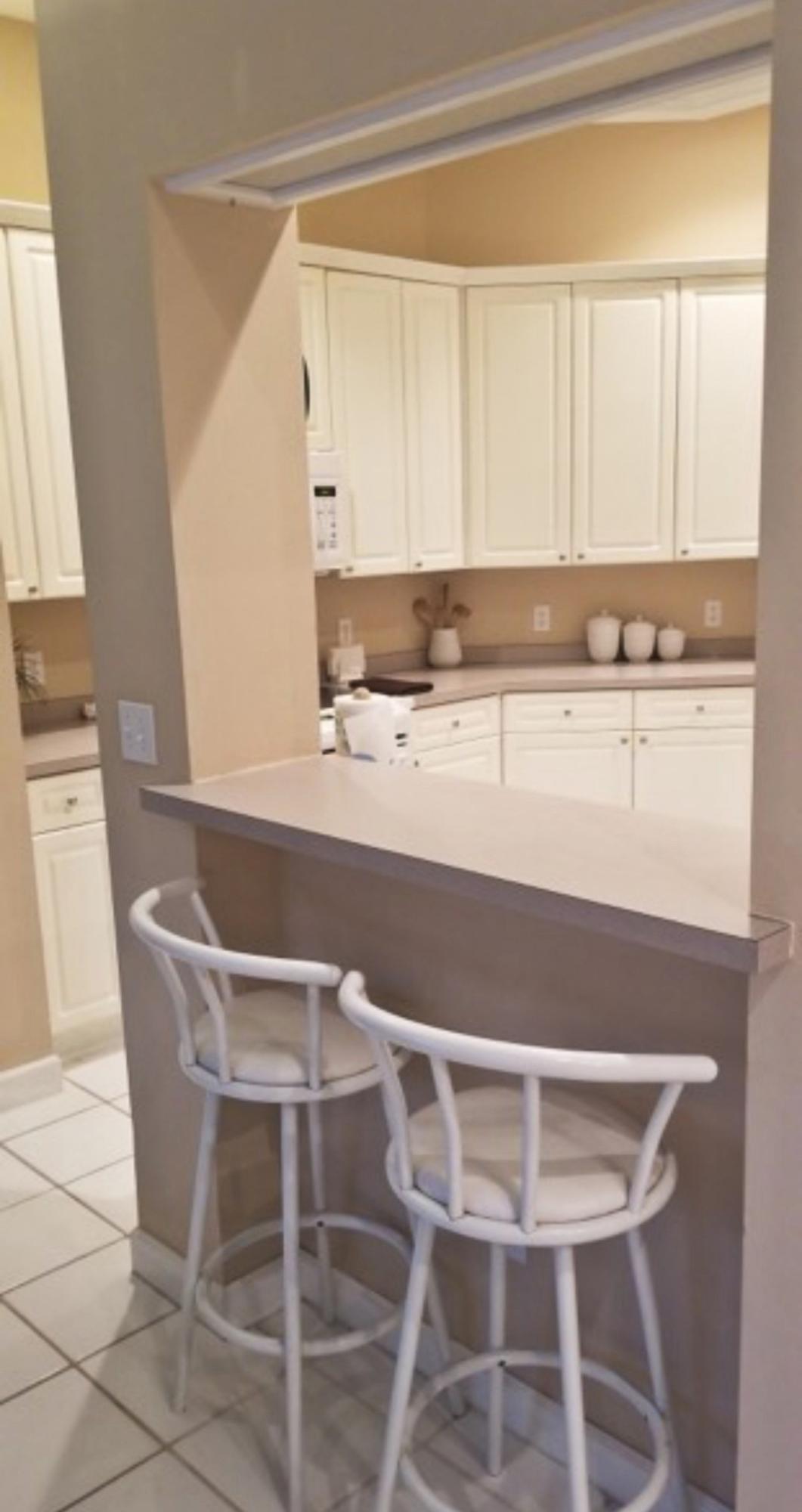 3911 Mesa Road Destin, FL 32541 - Photo 11 of 36 a view of a dining room with furniture and wooden floor