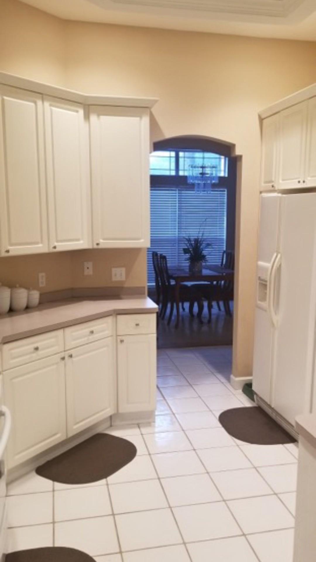 3911 Mesa Road Destin, FL 32541 - Photo 12 of 36 a kitchen with a sink and cabinets