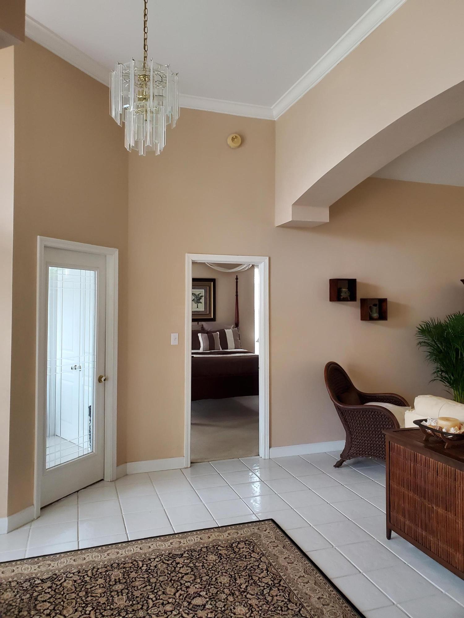 3911 Mesa Road Destin, FL 32541 - Photo 15 of 36 a living room with furniture and a chandelier
