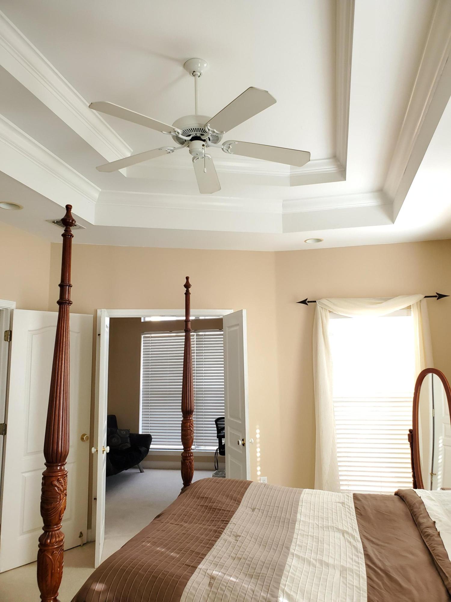 3911 Mesa Road Destin, FL 32541 - Photo 16 of 36 a bedroom with a bed next to a window