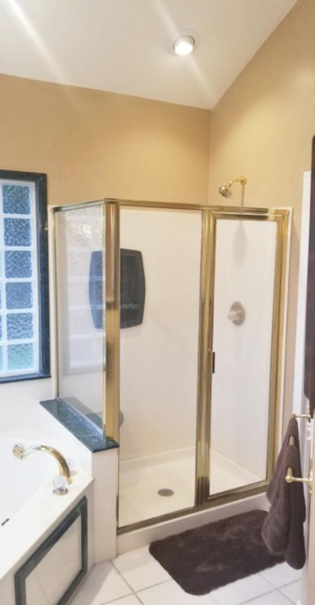 3911 Mesa Road Destin, FL 32541 - Photo 19 of 36 a bathroom with a tub a sink and a shower