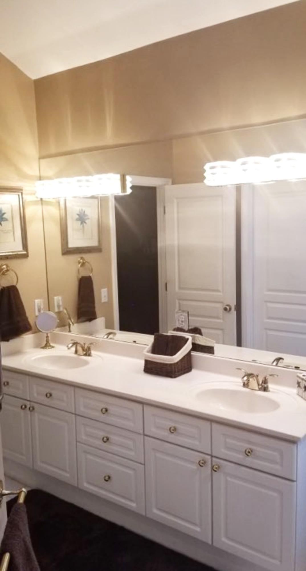 3911 Mesa Road Destin, FL 32541 - Photo 21 of 36 a bathroom with a double vanity sink and a mirror