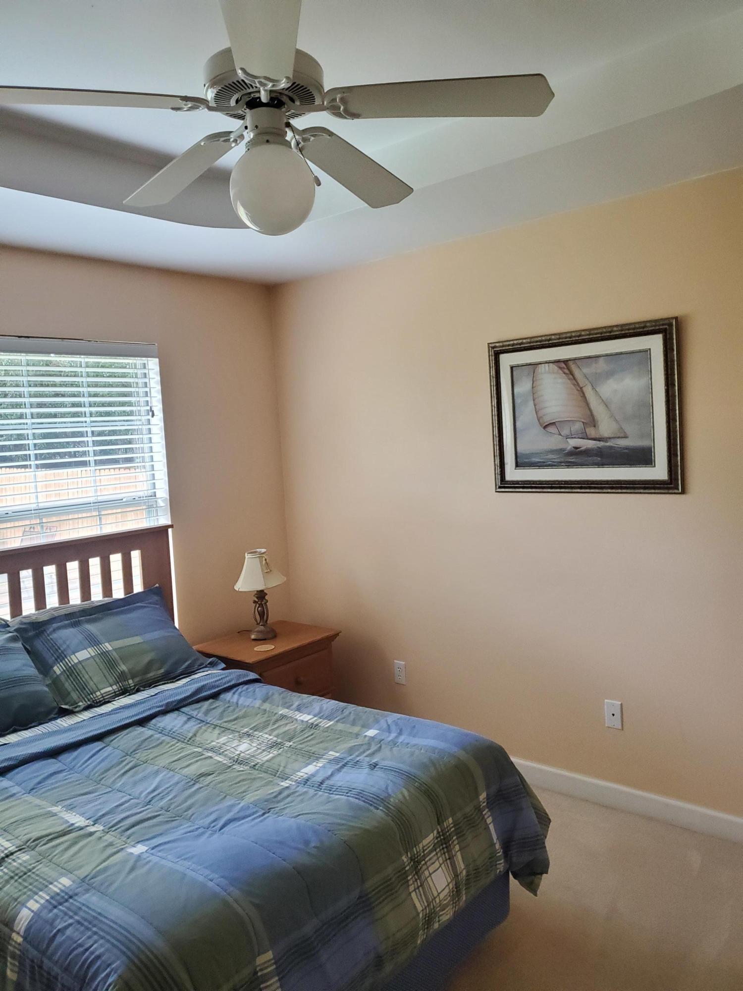3911 Mesa Road Destin, FL 32541 - Photo 26 of 36 a bedroom with a bed and a painting on the wall