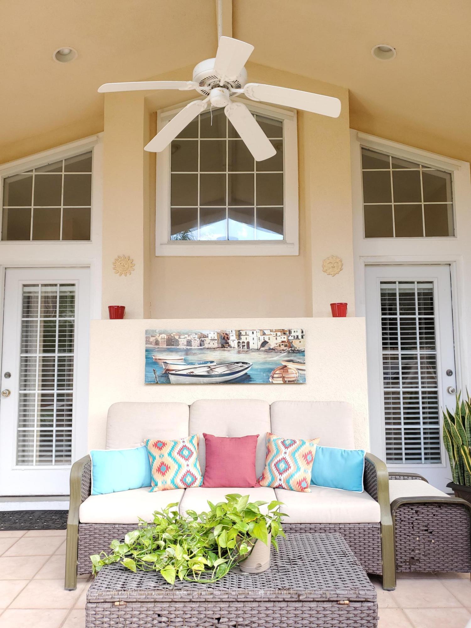 3911 Mesa Road Destin, FL 32541 - Photo 27 of 36 a front view of a house with outdoor seating