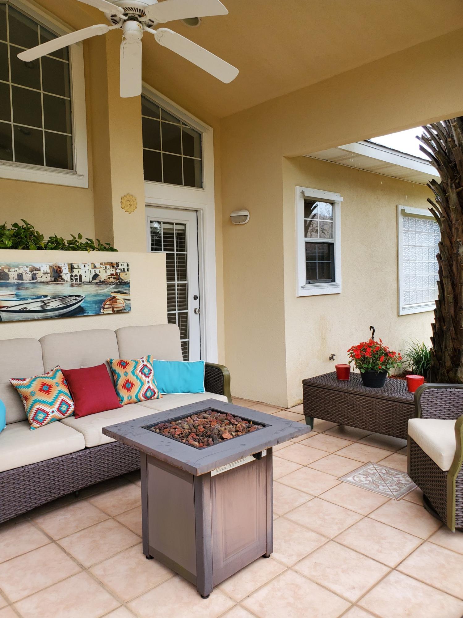 3911 Mesa Road Destin, FL 32541 - Photo 28 of 36 a view of a patio with dining table and chairs