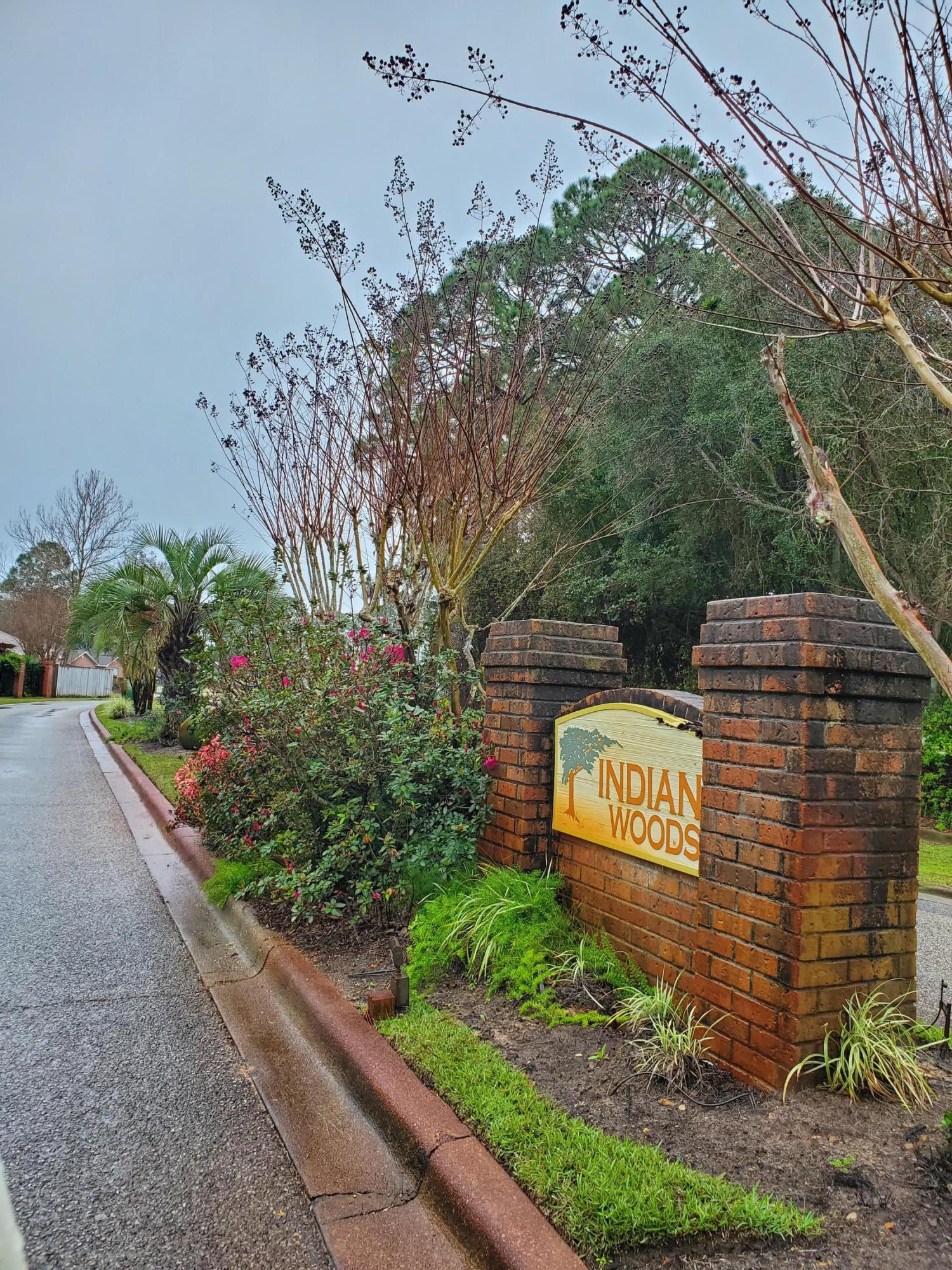 3911 Mesa Road Destin, FL 32541 - Photo 36 of 36 a sign that is sitting on a brick wall