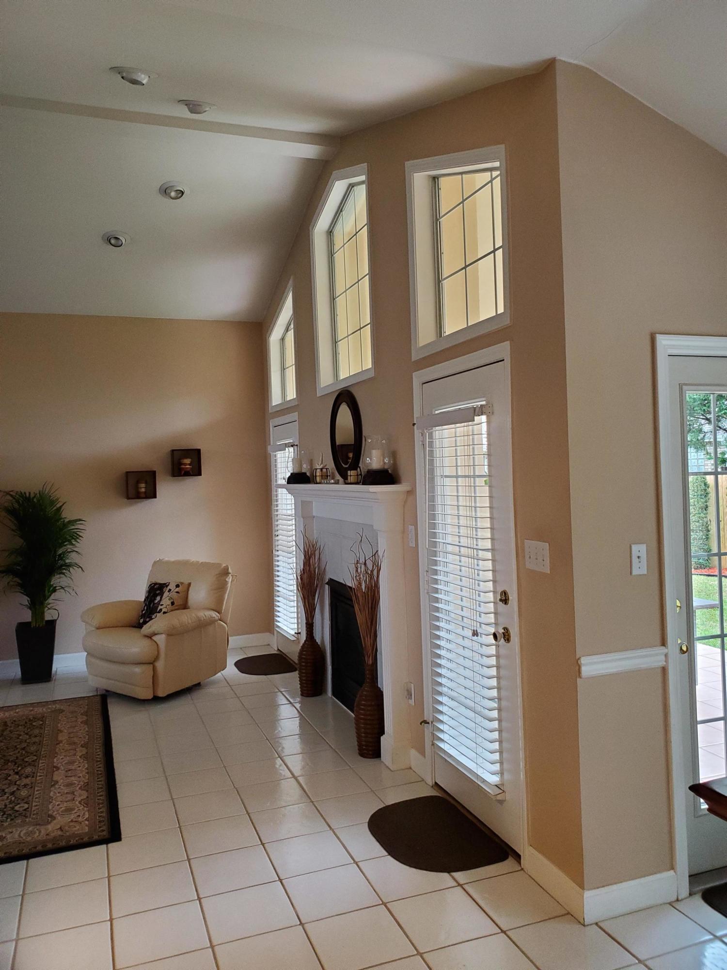 3911 Mesa Road Destin, FL 32541 - Photo 4 of 36 a living room with furniture and a fireplace