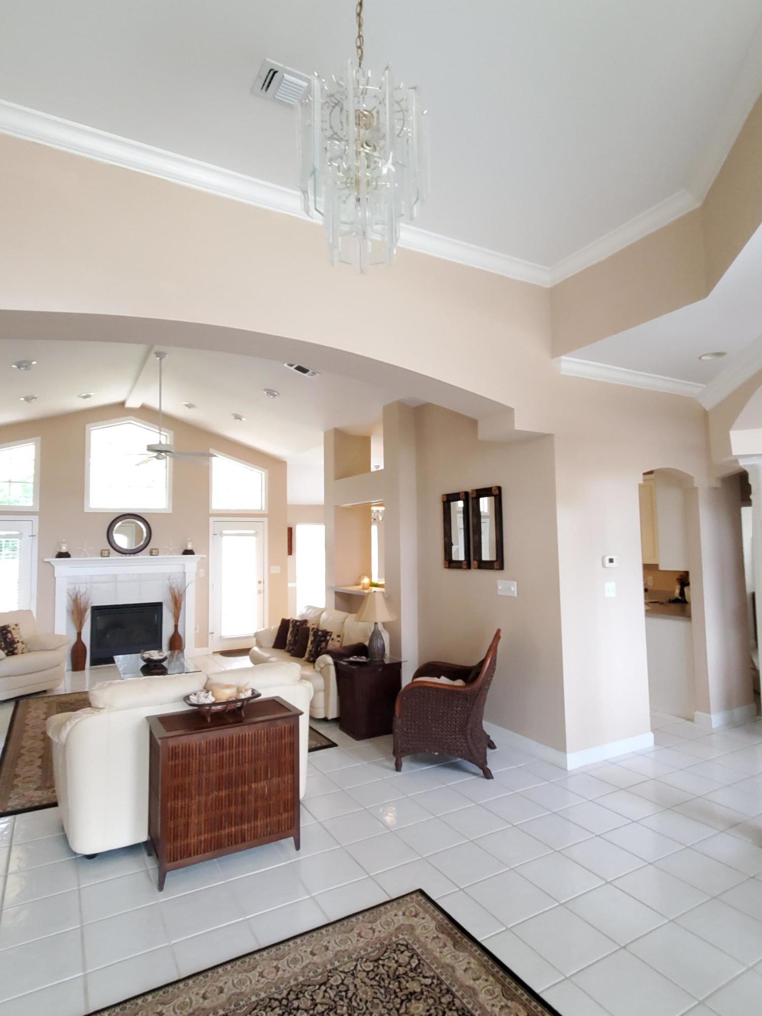 3911 Mesa Road Destin, FL 32541 - Photo 6 of 36 a living room with furniture and a chandelier