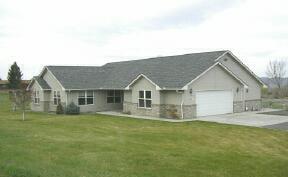 9440 Bittner Road Yakima, WA 98901 - Photo 2 of 8 a view of a house with a big yard and large tree